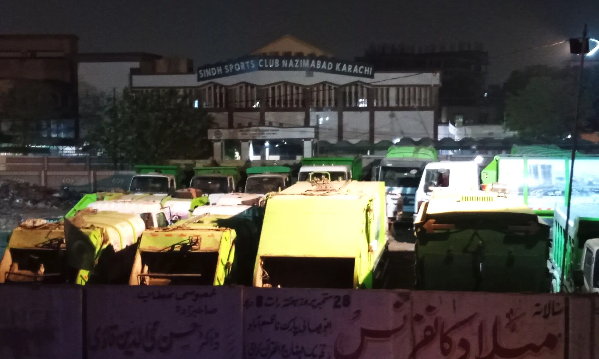 In the photo taken November 30, 2025, garbage trucks are parked right outside the premises of the Sindh Sports Board Club in Karachi.&mdash;Mohammad Asim Rehman