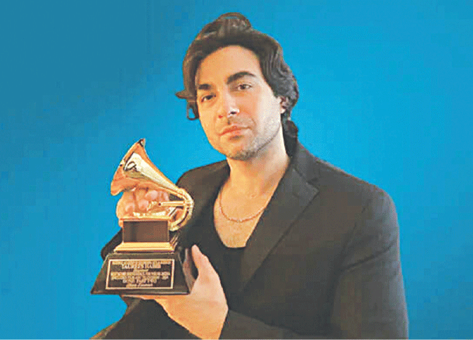 Taurees Habib with his Grammy for Best Score Soundtrack for Visual Media
