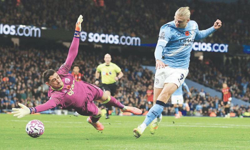 MANCHESTER: Manchester City’s Erling Haaland scores during the Premier League match against Bournemouth at the Etihad Stadium on Sunday.—Reuters MANCHESTER: Manchester City’s Erling Haaland scores during the Premier League match against Bournemouth at the Etihad Stadium on Sunday.—Reuters