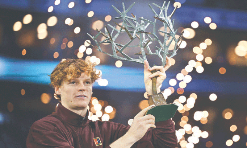 ITALY’S Jannik Sinner celebrates with the Paris Masters trophy after defeating Felix Auger-Aliassime of Canada in the final at the Paris La Defense Arena on Sunday.—AFP ITALY’S Jannik Sinner celebrates with the Paris Masters trophy after defeating Felix Auger-Aliassime of Canada in the final at the Paris La Defense Arena on Sunday.—AFP