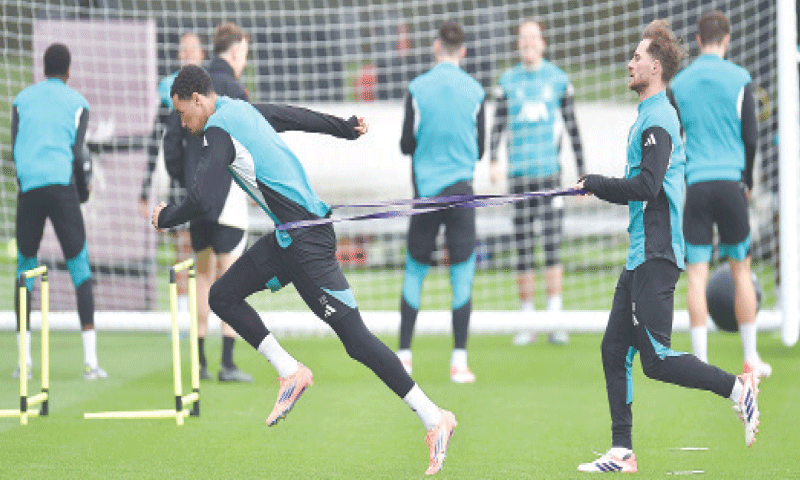 KIRKBY: Liverpool&rsquo;s Hugo Ekitike (L) and team-mate Alexis Mac Allister attend a training session on Monday.&mdash;AFP