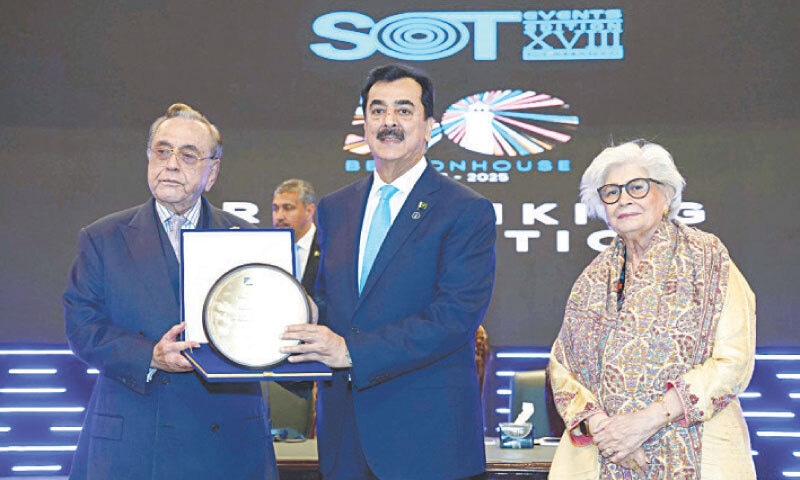 Acting President Syed Yousaf Raza Gilani receives a shield from Khurshid Mahmood Kasuri during the Golden Jubilee celebrations of the Beaconhouse School System in Islamabad on Tuesday. — White Star Acting President Syed Yousaf Raza Gilani receives a shield from Khurshid Mahmood Kasuri during the Golden Jubilee celebrations of the Beaconhouse School System in Islamabad on Tuesday. — White Star