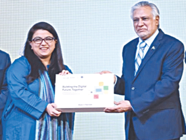 Deputy Prime Minister Ishaq Dar and IT Minister Shaza Fatima Khawaja pose with a Chromebook. &mdash;  X/MOITofficial