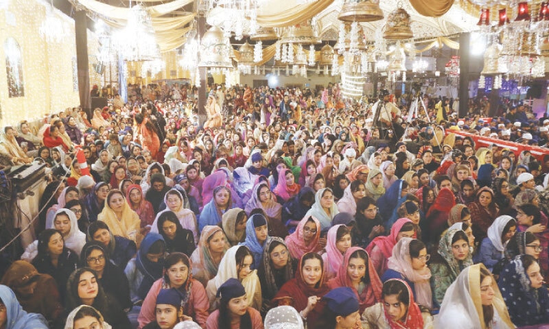 Sikh and Hindu women and children turn out in huge numbers for special prayers on the occasion of the 556th birth anniversary of Guru Nanak at Karachi&rsquo;s Guru Nanak Darbar Gurdwara on Wednesday night.&mdash; Shakil Adil / White Star