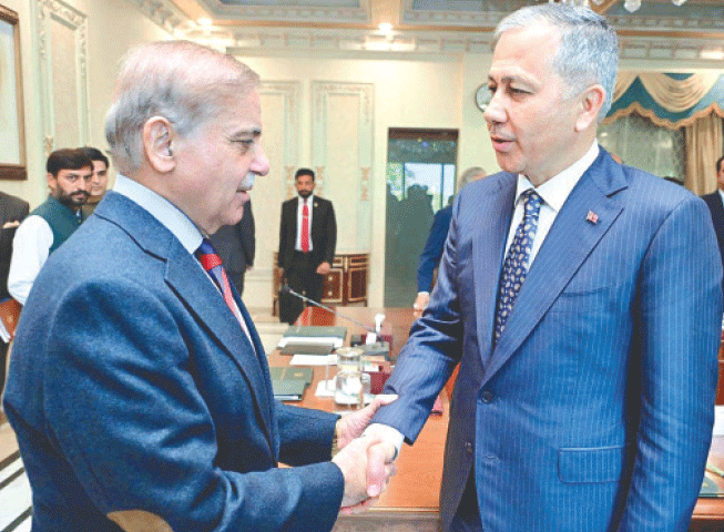  Turkish Interior Minister Ali Yerlikaya shakes hands with Prime Minister Shehbaz Sharif.&mdash;APP 