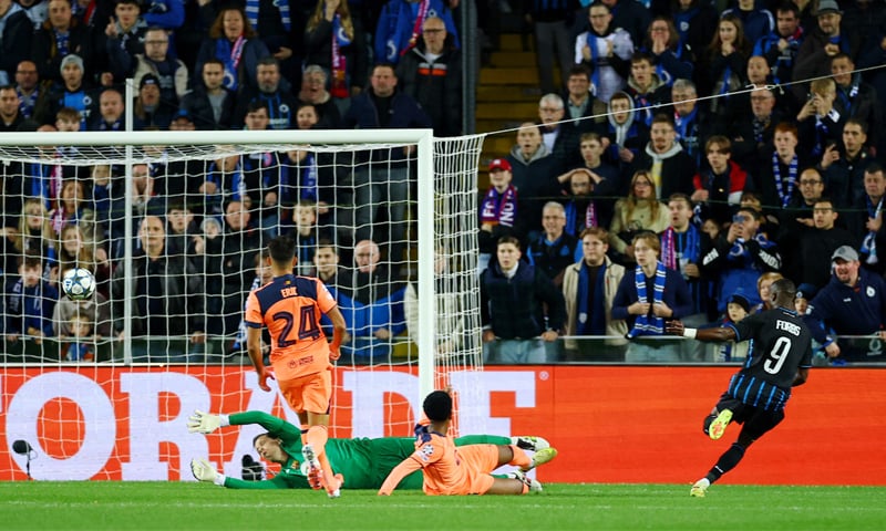 BRUGES: Club Brugge&rsquo;s Carlos Forbs (R) scores past Barcelona goalkeeper Wojciech Sczecny during their Champions League match at the Jan Breydel Stadium.&mdash;Reuters