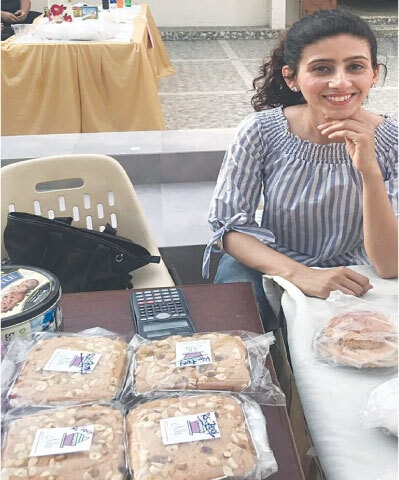 Baker Natalia Karanjia with the cakes