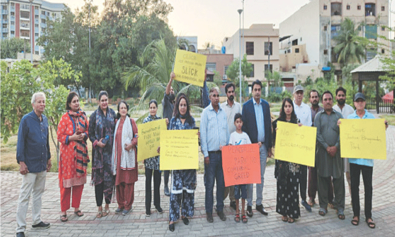 A group of residents protests over commercialisation of public parks.&mdash;Dawn