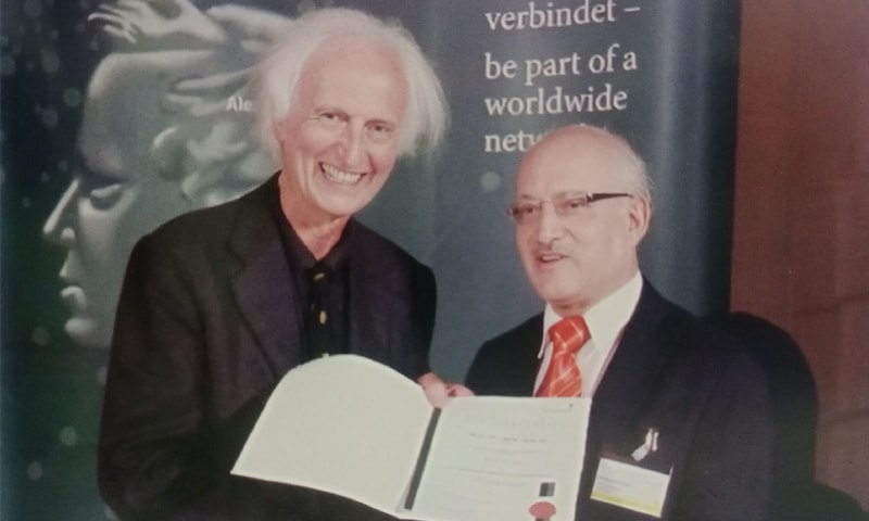 Dr Tariq Rahman receiving the Humboldt Research Award from Professor Helmut Schwarz, June 2012, Berlin |Picture from the book