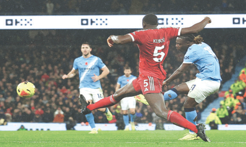 MANCHESTER: Jeremy Doku (R) of Manchester City shoots to score against Liverpool during their Premier League match at the Etihad Stadium.—Reuters MANCHESTER: Jeremy Doku (R) of Manchester City shoots to score against Liverpool during their Premier League match at the Etihad Stadium.—Reuters