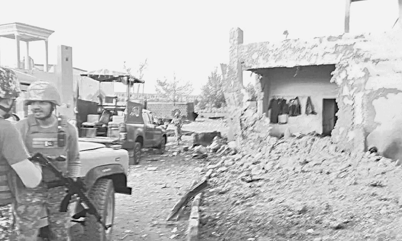 SECURITY pesonnel stand guard outside the Cadet College, Wana, after terrorist attack.&mdash;Dawn