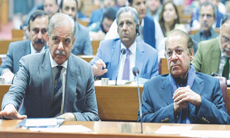 PRIME Minister Shehbaz Sharif with his brother Nawaz Sharif in a session of the National Assembly.&mdash;APP