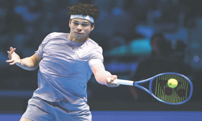 TURIN: Ben Shelton of the US hits a return against Canada&rsquo;s Felix Auger-Aliassime during their ATP Finals match at Palasport Olimpico on Wednesday.&mdash;AFP