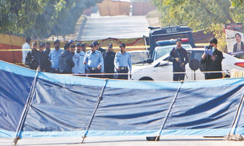Islamabad police officials carry out investigations at the site of the Tuesday&rsquo;s suicide blast outside the districts courts in Islamabad&rsquo;s G-11 sector on Wednesday. &mdash; Photo by Mohammad Asim