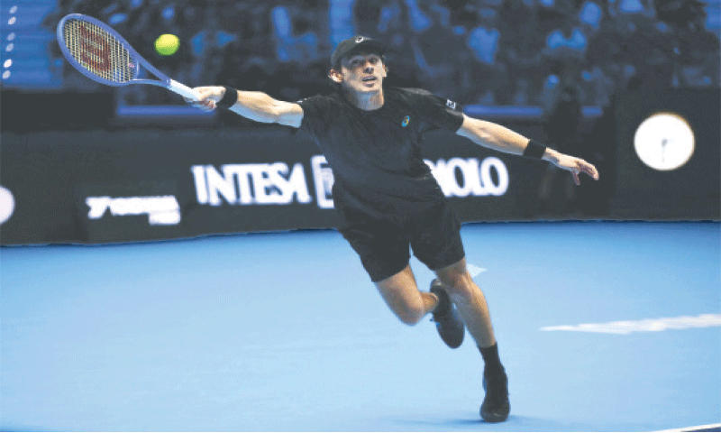 AUSTRALIA’S Alex De Minaur stretches for a return during the ATP Finals match against Taylor Fritz of the US at the Palasport Olimpico on Thursday.—AFP AUSTRALIA’S Alex De Minaur stretches for a return during the ATP Finals match against Taylor Fritz of the US at the Palasport Olimpico on Thursday.—AFP