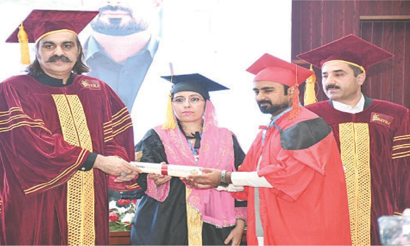 Former chief minister Ali Amin Gandapur hands over degree to a student at the convocation of Gomal University, DI Khan. — Dawn Former chief minister Ali Amin Gandapur hands over degree to a student at the convocation of Gomal University, DI Khan. — Dawn