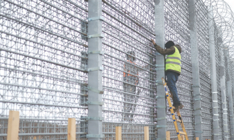 WORKERS construct a concrete wall, part of which extends beyond the ‘Blue Line’, a UN-mapped line separating Lebanon from Israel and the Israeli-occupied Golan Heights.—Reuters WORKERS construct a concrete wall, part of which extends beyond the ‘Blue Line’, a UN-mapped line separating Lebanon from Israel and the Israeli-occupied Golan Heights.—Reuters