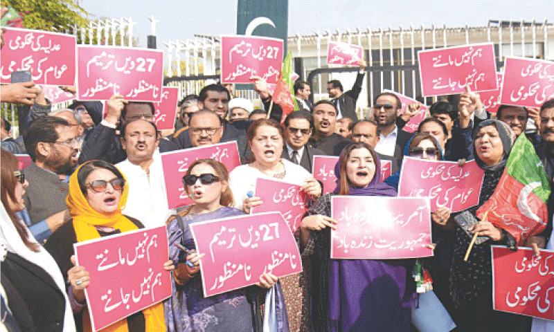 ISLAMABAD: Members of the opposition alliance Tehreek-i-Tahaffuz Ayeen-i-Pakistan protest against the 27th Amendment, outside Parliament House.&mdash;Mohammad Asim/White Star