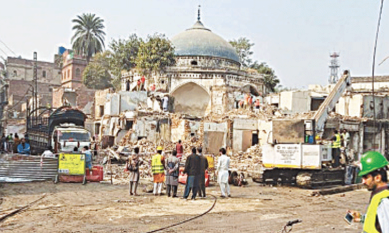 Cycle market shops being demolished for the Nila Gumbad parking plaza project. — Dawn Cycle market shops being demolished for the Nila Gumbad parking plaza project. — Dawn