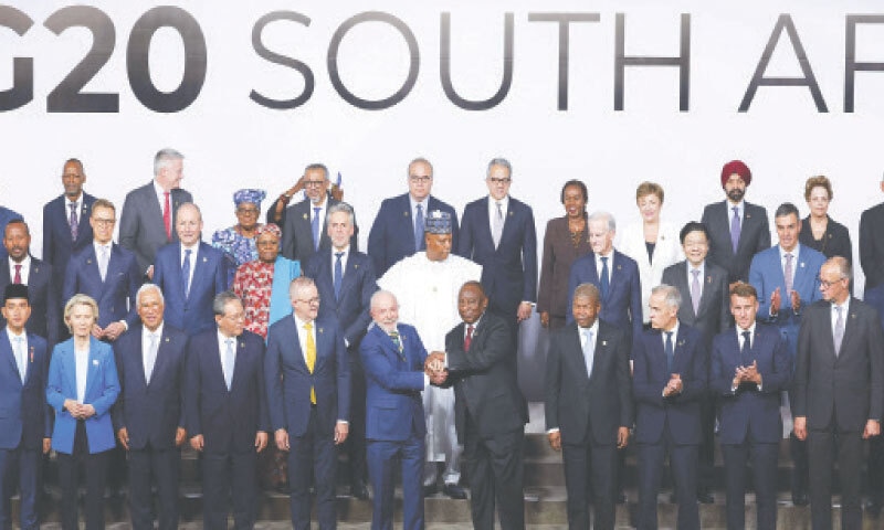 BRAZILIAN President Luiz Inacio Lula da Silva (left) and South Africa&rsquo;s President Cyril Ramaphosa shake hands as they pose with other leaders for a group photo during a G20 summit.&mdash;AFP
