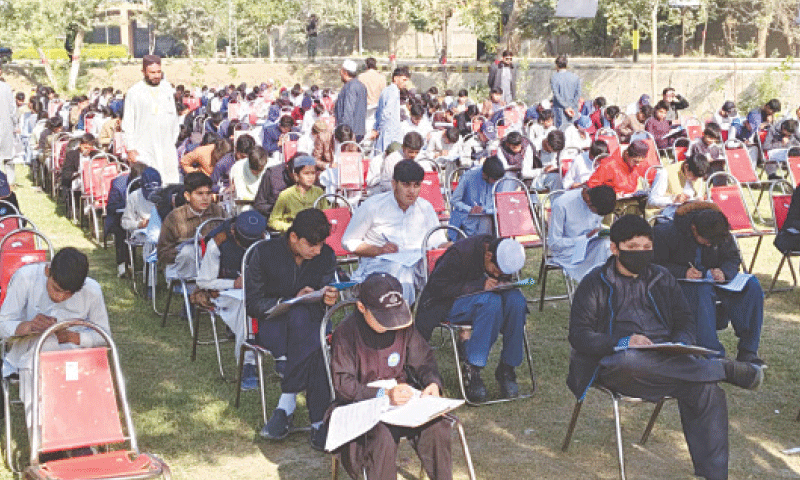 Students of government schools appear in a written test in Bannu on Sunday. — Dawn Students of government schools appear in a written test in Bannu on Sunday. — Dawn