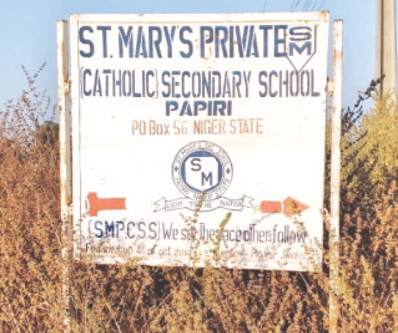    PAPIRI (Nigeria): A sign directing people to St. Mary&rsquo;s School, which was the site of the kidnapping of more than 300 children and staff a couple of days ago.&mdash;Reuters  