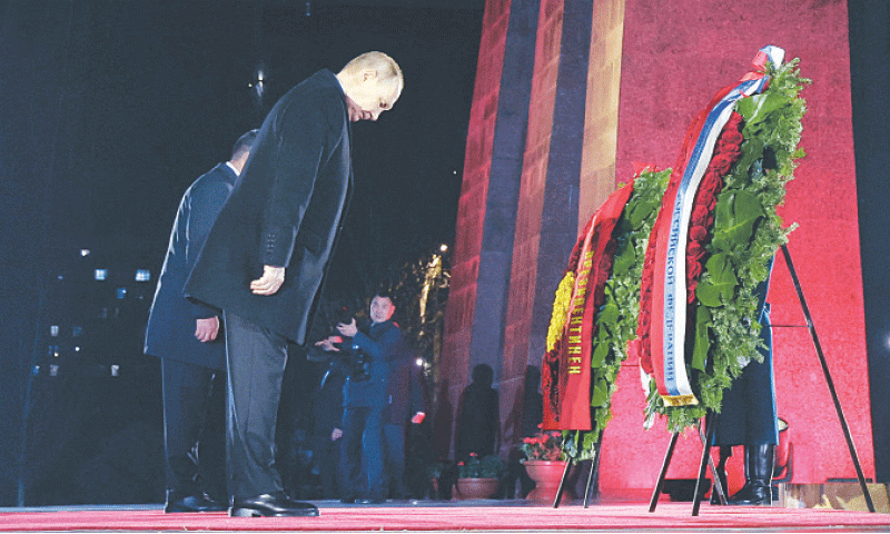 RUSSIAN President Vladimir Putin and his Kyrgyz counterpart Sadyr Japarov attend a wreath-laying ceremony at a memorial for soldiers in Bishkek, the capital of Kyrgyzstan.&mdash;Reuters