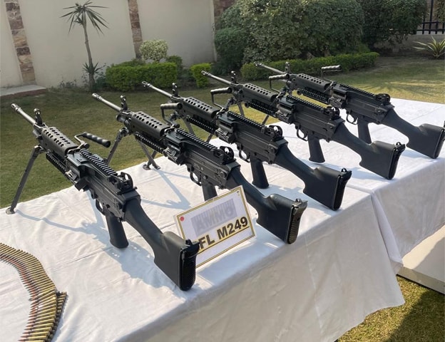 American and Nato-issued weapons seized from militants during military operations in KP are displayed for the media.—Dawn