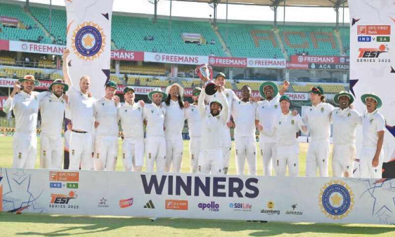 SOUTH AFRICAN captain Temba Bavuma lifts the trophy as he celebrates with team-mates after defeating India in the second Test at the Barsapara Cricket Stadium on Wednesday.—AFP SOUTH AFRICAN captain Temba Bavuma lifts the trophy as he celebrates with team-mates after defeating India in the second Test at the Barsapara Cricket Stadium on Wednesday.—AFP