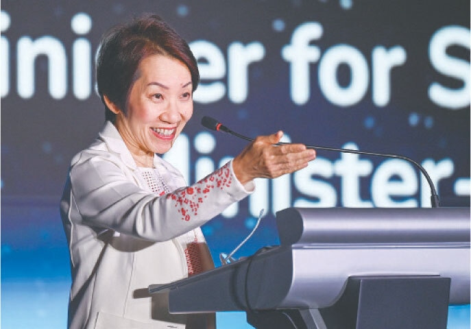 GRACE Fu, Singapore’s environment minister, speaks at the opening ceremony of the World Robot Olympiad.—AFP