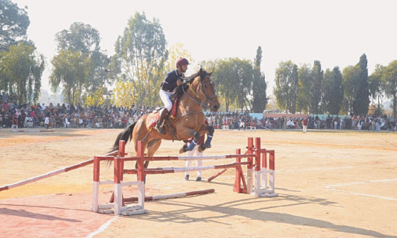 A horse clears a hurdle during the Parents&rsquo; Day function in a Mansehra college on Saturday. &mdash; Photo by Nisar Ahmad Khan