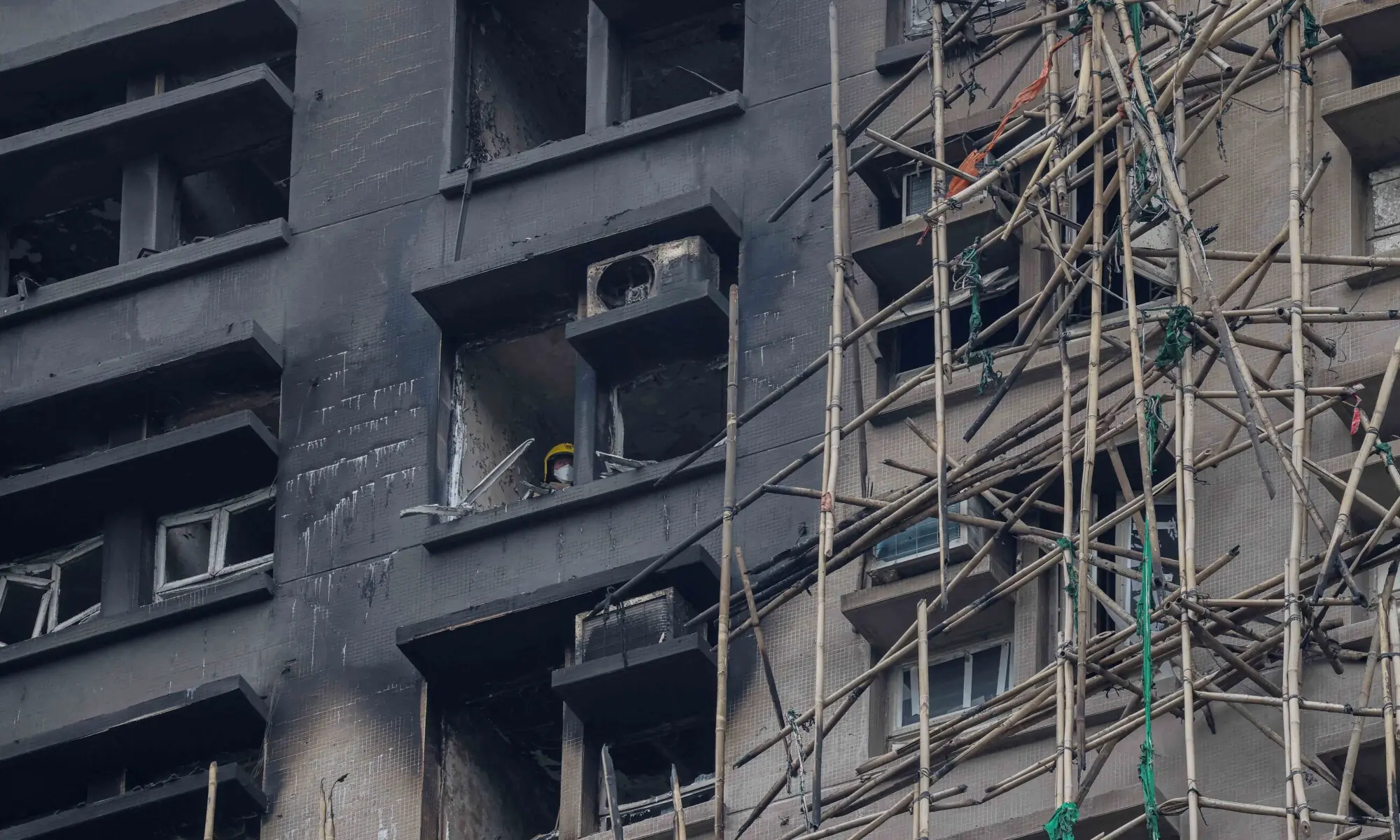 A firefighter searches a fire-damaged apartment unit at the Wang Fuk Court housing complex, following the deadly fire on Wednesday, in Tai Po, Hong Kong, China, November 30, 2025. — Reuters A firefighter searches a fire-damaged apartment unit at the Wang Fuk Court housing complex, following the deadly fire on Wednesday, in Tai Po, Hong Kong, China, November 30, 2025. — Reuters
