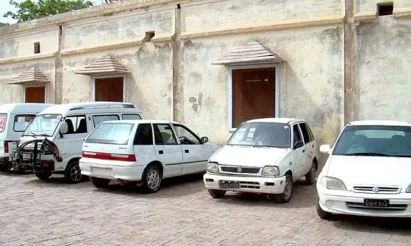 Undated image shows several cars parked at an unspecified location. &mdash;APP/File