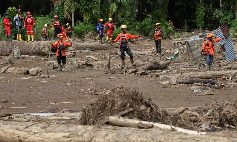 Rescuers search for victims in an area affected by deadly flash floods following heavy rains in Palembayan, Agam regency, West Sumatra province, Indonesia on Dec 4, 2025. —Reuters