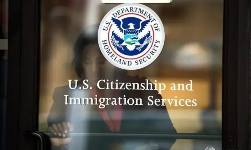 A woman leaves the US Citizenship and Immigration Services offices in New York, US, August 15, 2012. &mdash; Reuters