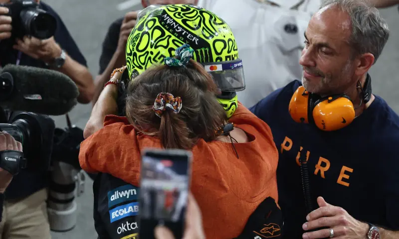 McLaren&rsquo;s Lando Norris celebrates after becoming the 2025 Formula One World Champion with his mother Cisca Wauman and father Adam Norris at the Abu Dhabi Grand Prix, Yas Marina Circuit, Abu Dhabi, United Arab Emirates on December 7, 2025. &mdash; Reuters