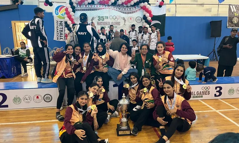 Sindh pose with the champions trophy and coach Humaira Huma after defeating Wapda in the women&rsquo;s netball final on Sunday at the PSB National Coaching Centre. &mdash; Photo via author