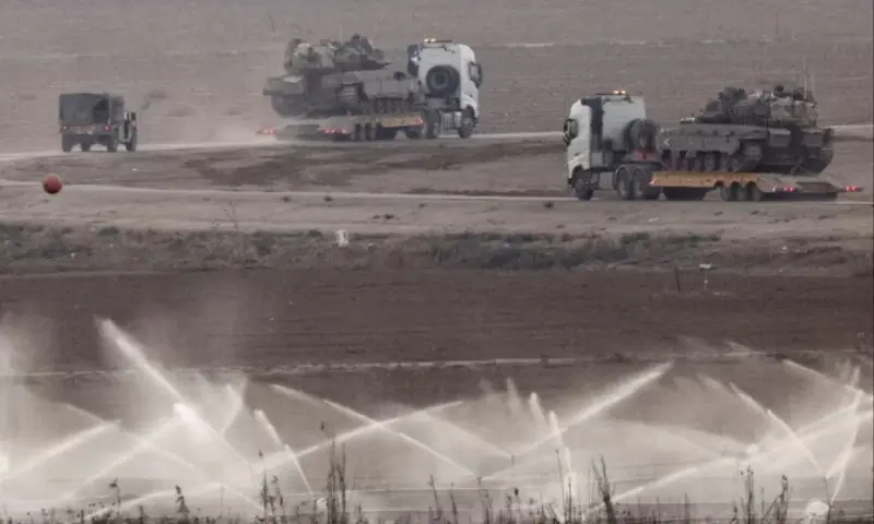 Trucks transport tanks on the Israeli side of the border with Gaza, Israel, November 18, 2025. &mdash; Reuters/Amir Cohen