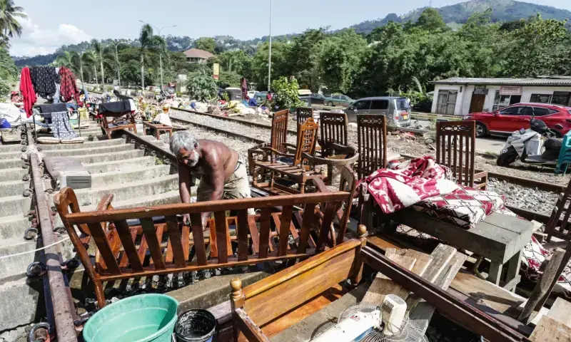 A flood victim restores his belongings in the aftermath of Cyclone Ditwah, along railway tracks in Kandy on December 6, 2025. — AFP A flood victim restores his belongings in the aftermath of Cyclone Ditwah, along railway tracks in Kandy on December 6, 2025. — AFP