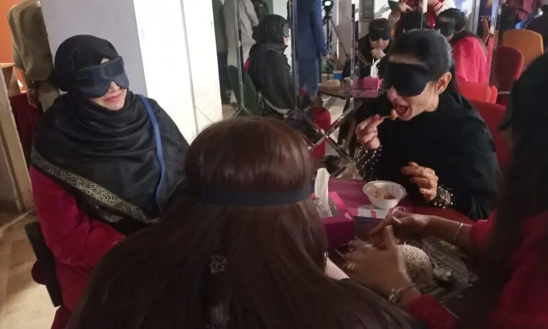 Actor Sarwat Gilani (right) enjoys her dinner with other guests at the event. — Photo by the writer