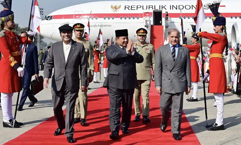 President Asif Ali Zardari (R)  and Prime Minister Shehbaz Sharif (L) receives Indonesia&rsquo;s President Prabowo Subianto (C) upon his arrival in Islamabad on Dec8. &mdash; Photo courtesy Murtaza Solangi/X