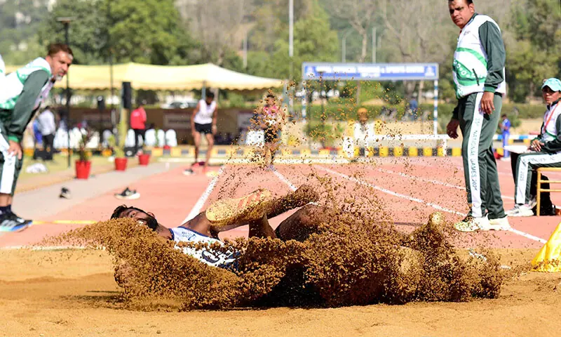 Pakistan Navy&rsquo;s Ansar Abbas participates in the long jump competition of the National Games at NPT&SC in Karachi on December 8, 2025.&mdash;Tahir Jamal/White Star