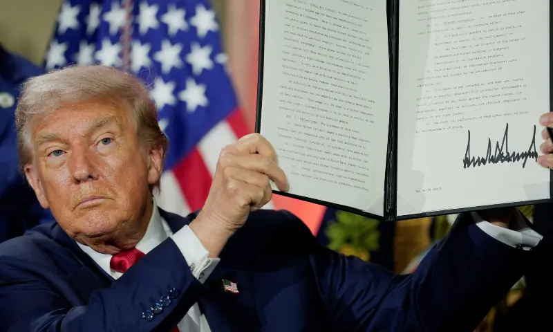 US President Donald Trump holds an executive order related to artificial intelligence after signing it during the &ldquo;Winning the AI Race&rdquo; Summit in Washington DC, US on July 23, 2025. &mdash; Reuters/File