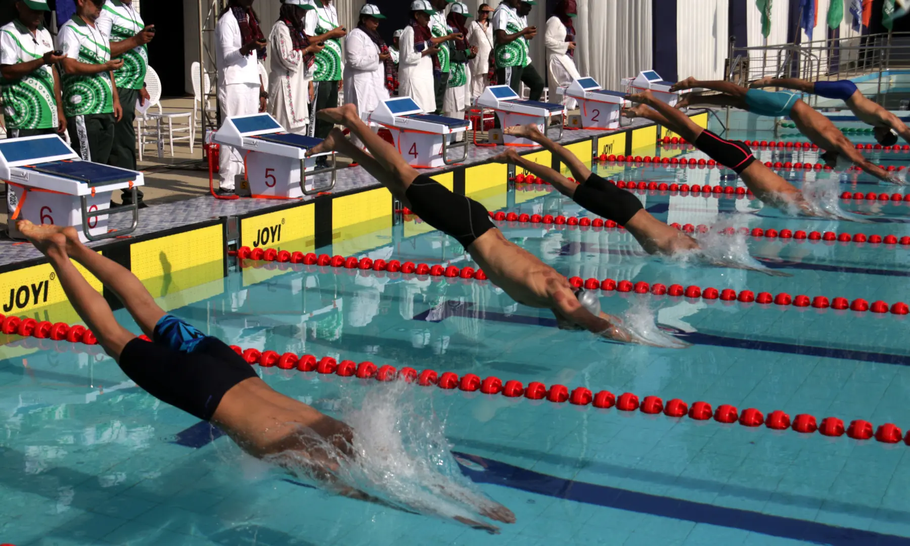 Swimmers compete in the Men&rsquo;s 100m Freestyle at the KMC Sports Complex on Tuesday during the ongoing 35th National Games in Karachi. &mdash; Photo by Shakil Adil