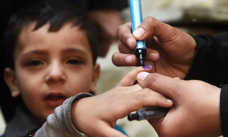 In this file photo, a health worker marks a child&rsquo;s finger after administering polio drops.&mdash;AFP/File