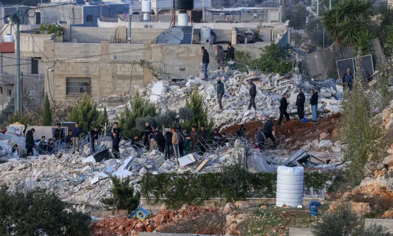 People stand on the rubble of two homes belonging to Palestinians that were demolished by Israel&rsquo;s security forces for reportedly being built without permits in the village of Husan near Bethlehem, in the occupied West Bank on December 9, 2025. &mdash; AFP