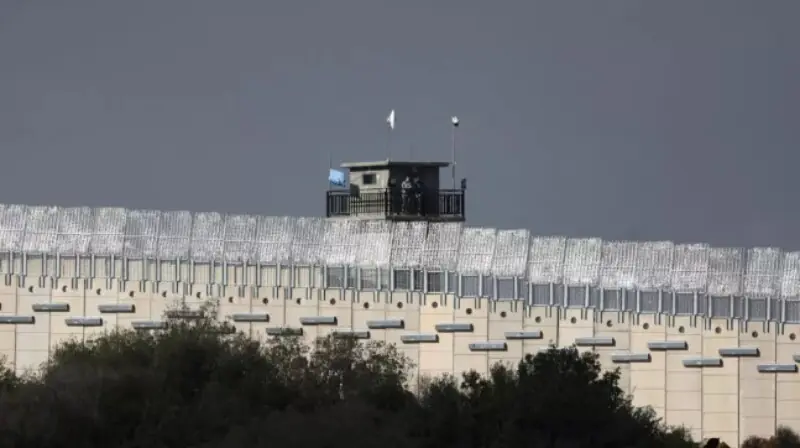UNIFIL peacekeepers stand on a watchtower near a concrete wall along Lebanon’s southern border on November 16. —AFP UNIFIL peacekeepers stand on a watchtower near a concrete wall along Lebanon’s southern border on November 16. —AFP