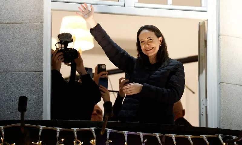 Nobel peace laureate Maria Corina Machado greets supporters from a balcony of the Grand Hotel in Oslo, Norway, early on December 11, 2025. &mdash;AFP