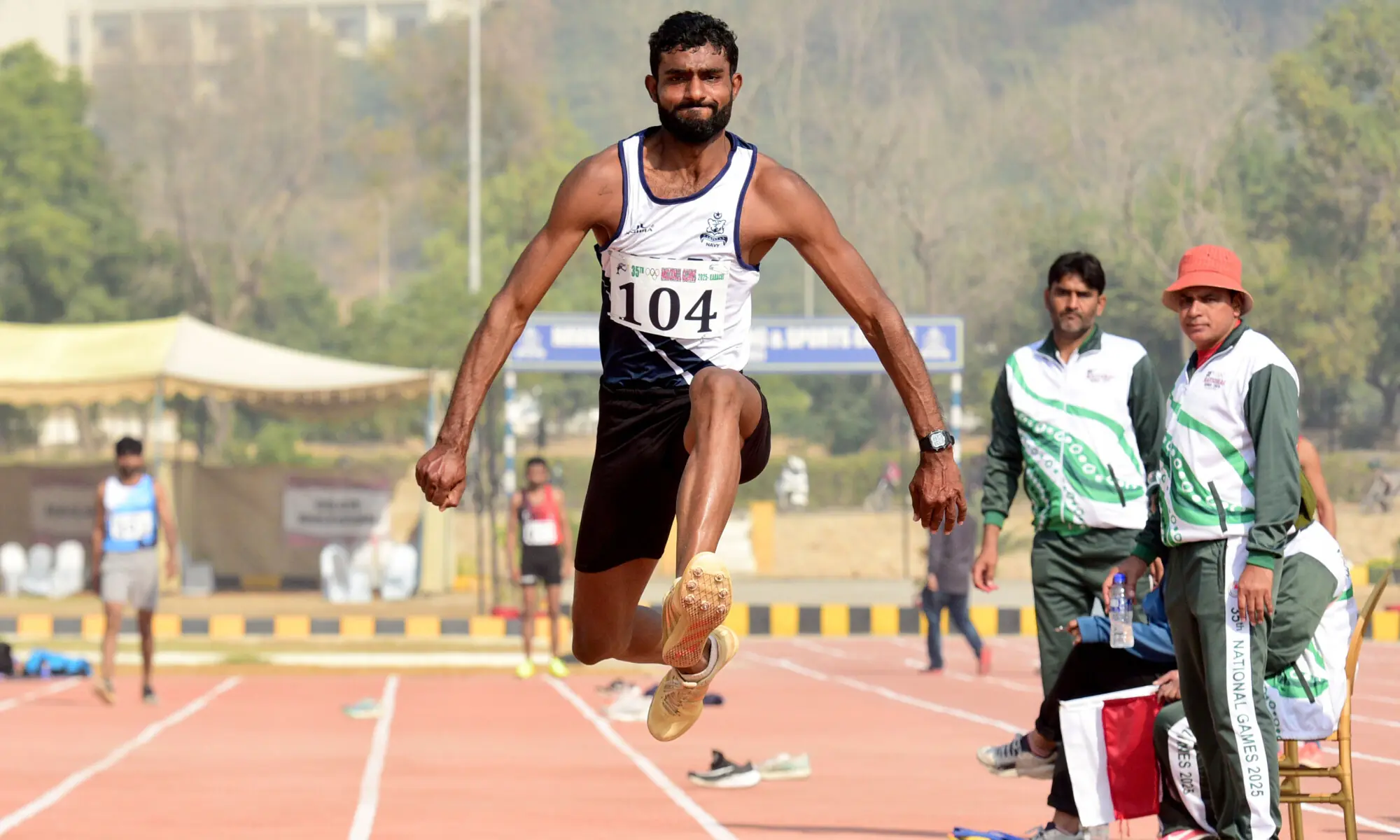 Pakistan Navy&rsquo;s Ansar Abbas takes part in the National Games triple jump final at NPT&SC in Karachi on December 11, 2025.&mdash;Tahir Jamal/White Star