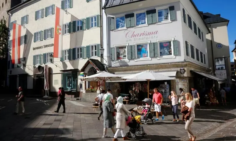 Shoppers walk past a souvenir shop in Zell am See, Austria on August 31, 2016. — Reuters Shoppers walk past a souvenir shop in Zell am See, Austria on August 31, 2016. — Reuters